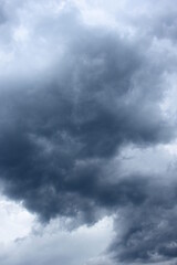 Dark grey threatening thunderclouds, rain clouds in the dark sky, weather change, summer thunderstorms, thunderclouds and rain clouds dark and grey, grey sky