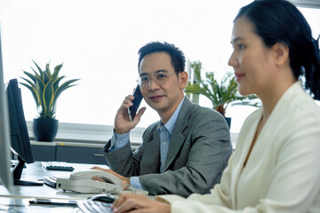 Businessmen provide customer information by telephone.Call centre support distance communication concept. 