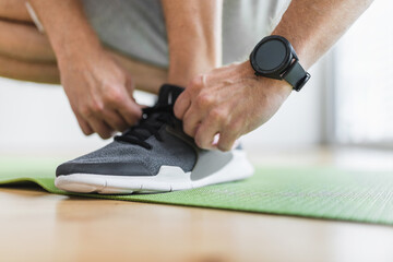 Fototapeta premium Handsome man working out at home