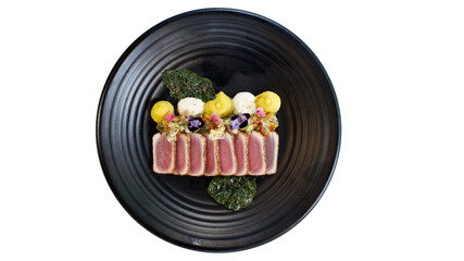 Top view of Tuna Tataki on black plate, Isolated white background.