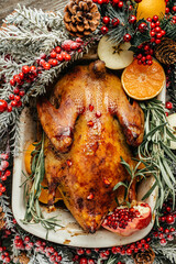 Baked whole duck with fresh rosemary and oranges, Roasted duck. Dish for Christmas Eve, top view
