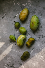 Fresh PawPaw Fruit Arranged On a Gray Textured Background