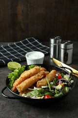 Сoncept of tasty food with deep-fried shrimp on dark table