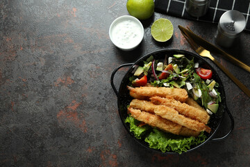 Сoncept of tasty food with deep-fried shrimp on dark table