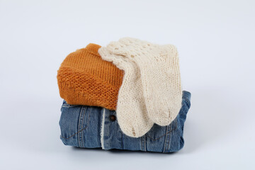 Winter clothes on white background, close up