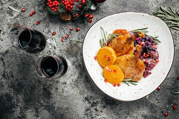 Delicious goose legs served with red cabbage on a festive table. Dish for Christmas Eve. banner, menu, recipe place for text, top view