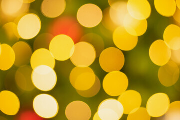 Golden and multicolored bokeh circle background for christmas and happy new year with space to display messages.