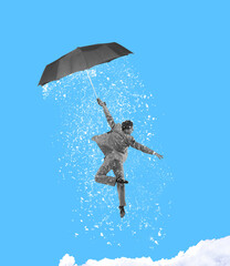 Contemporary art collage. Young man, male ballet dancer wearing grey suit flying an umbrella and...