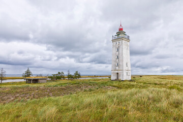 Fototapeta na wymiar Retired lighthouse at Saksfjed-Hyllekrog nature reserve on the island of Lolland, Denmark