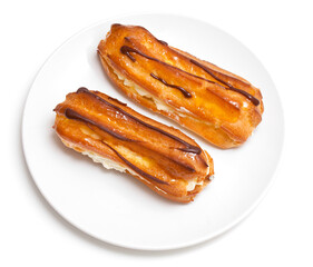 two eclairs on a white plate