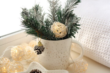  Christmas garland, fir branches on a white frozen window. There is room for text.