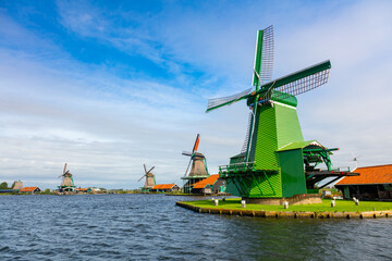 Fototapeta na wymiar Famous Dutch village with windmills, Agricultural historical landscape. Tourism. Popular Holland, Netherlands, Europe.