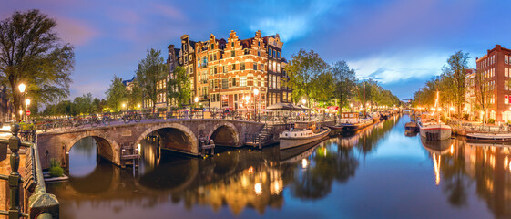 Amsterdam. Panorama of the historic city center of Amsterdam. Traditional houses and bridges of Amsterdam town. European travel to the historic city. Europe, Netherlands, Holland, Amsterdam.