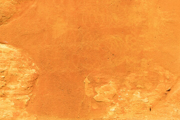 Orange painted textured wall background
