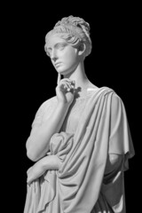 Gypsum copy of ancient statue of thinking young lady isolated on black background. Side view of...