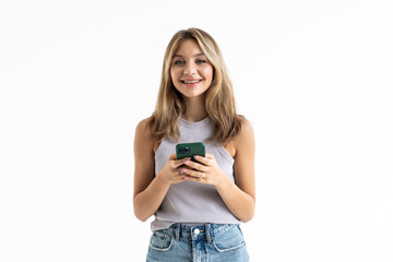 Portrait of young happy woman using mobile phone on white background