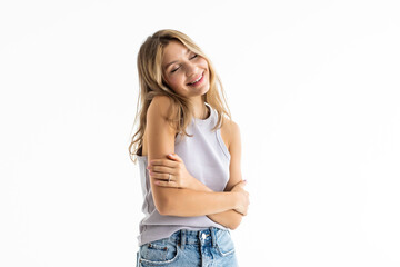 Portrait of happy woman standing with arms folded isolated on a white background