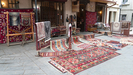 handmade carpets are sold on the street. street trade