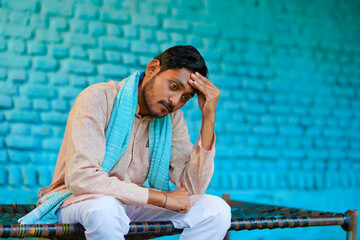 Young indian farmer in depression.