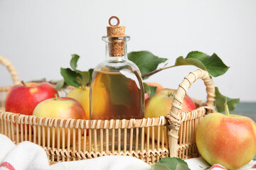 Natural apple vinegar and fresh fruits on tray