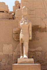 The statues of Pharaoh Ramses III guarding the precinct of the temple of Karnak, Luxor, Egypt.