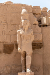 The statues of Pharaoh Ramses III guarding the precinct of the temple of Karnak, Luxor, Egypt.