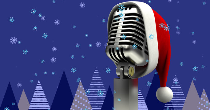 Image of santa hat on vintage microphone and snow falling on blue background