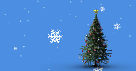 Fototapeta premium Image of snow falling over christmas tree on blue background