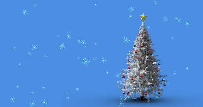 Image of snow falling over christmas tree on blue background