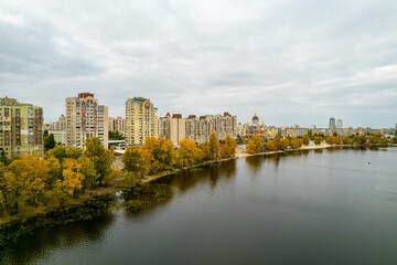 Fototapeta na wymiar Aerial view of the city by the river in autumn