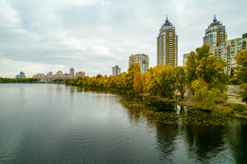 Aerial view of the city by the river in autumn