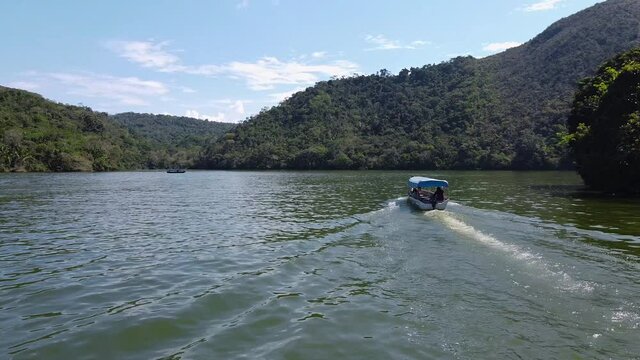 Drone shot of boat, islands and blue lake in the peruvian Amazonas jungle. Tarapoto, Per&uacute;.