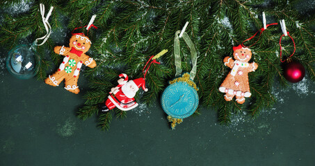 Christmas banner with fir branches and Christmas toys, top view. Festive new year background.