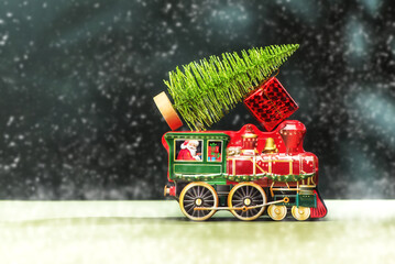 Christmas or New Year card with Santa Claus on the train with gifts. Festive decorations and presents for winter holidays.