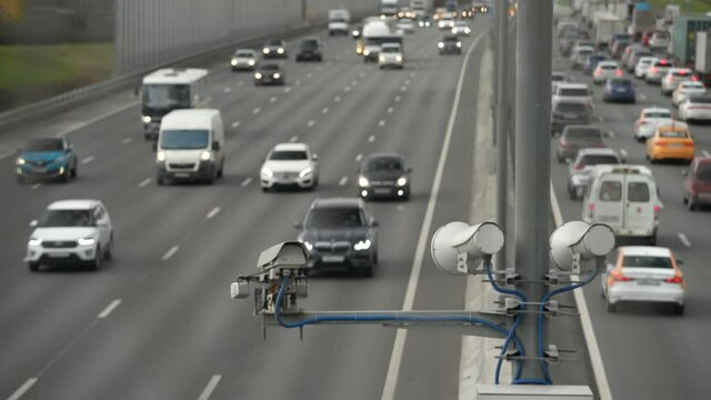 Road security camera for speed pacification installed on the expressway. Cloudy day