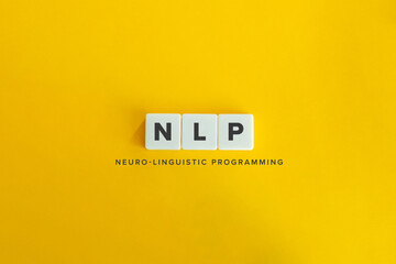 NLP (Neuro-linguistic programming) banner and concept. Block letters on bright orange background....