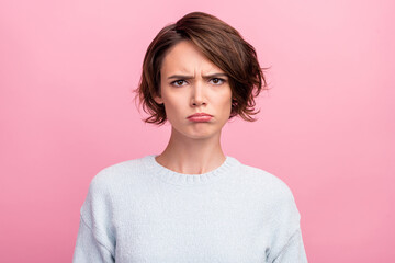 Photo of frustrated grumpy sad lady puffed cheeks lips wear blue sweater isolated pink color...