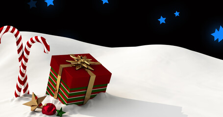 Image of presents and christmas candies lying on snow with blue stars falling in background