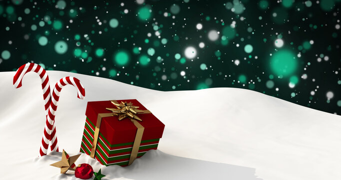Image of presents and christmas candies lying on snow with green lights falling in background