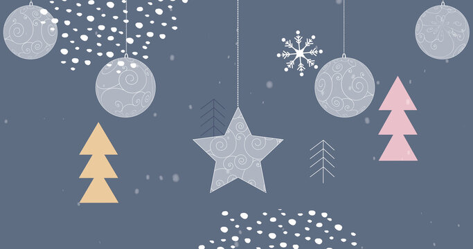 Christmas hanging decorations over snow falling over christmas tree icons on blue background