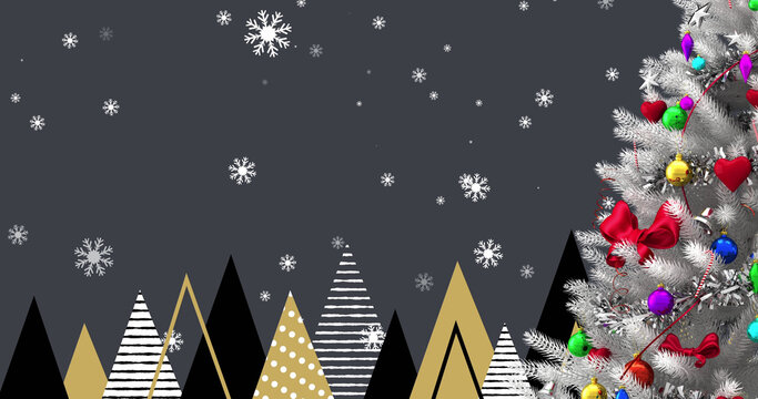 Image of christmas tree with decorations over trees and snow falling on black background