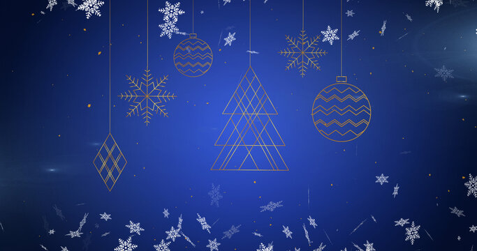 Image of christmas tree decorations over snow falling on blue background