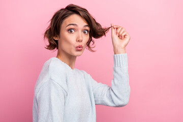 Photo of excited crazy girlish lady hold dry curl open mouth wear blue sweater isolated pink color background