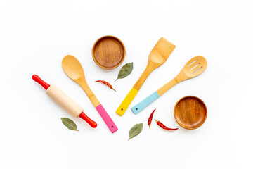 Fototapeta na wymiar Flat lay of wooden kitchen utensils and cookware