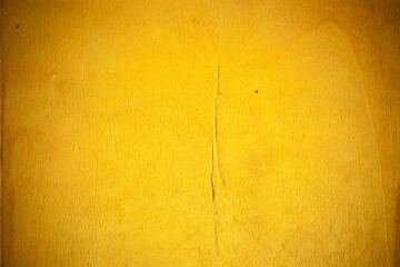 Yellow wooden board background.