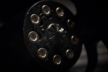 revolver cylinder with Flobert ammo 4mm on dark wooden background