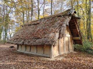 Reconstructed Celtic village (Keltendorf) on Druidenpfad hiking trail in autumn forest near the...