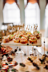food buffer catering. Different canapes and appetizer on table