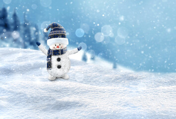 Happy Snowman in winter scenery with copy space