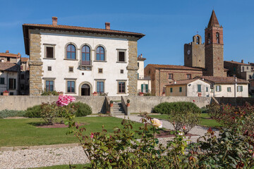 Monte San Savino. Arezzo. Palazzo Del Monte. Facciata sul giardino verticale con Torre dell' Orologio e chiesa della Misericordia